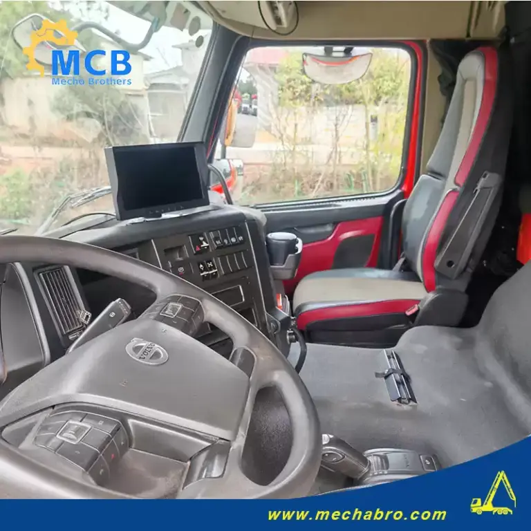 SANY concrete pump truck 56m Volvo cab interior in an original Mechabro field photo
