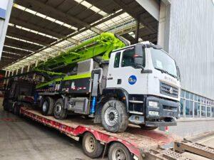 Original Mechabro field photo of a 2023 Zoomlion concrete pump truck 43m loaded for an Africa-bound customer shipment