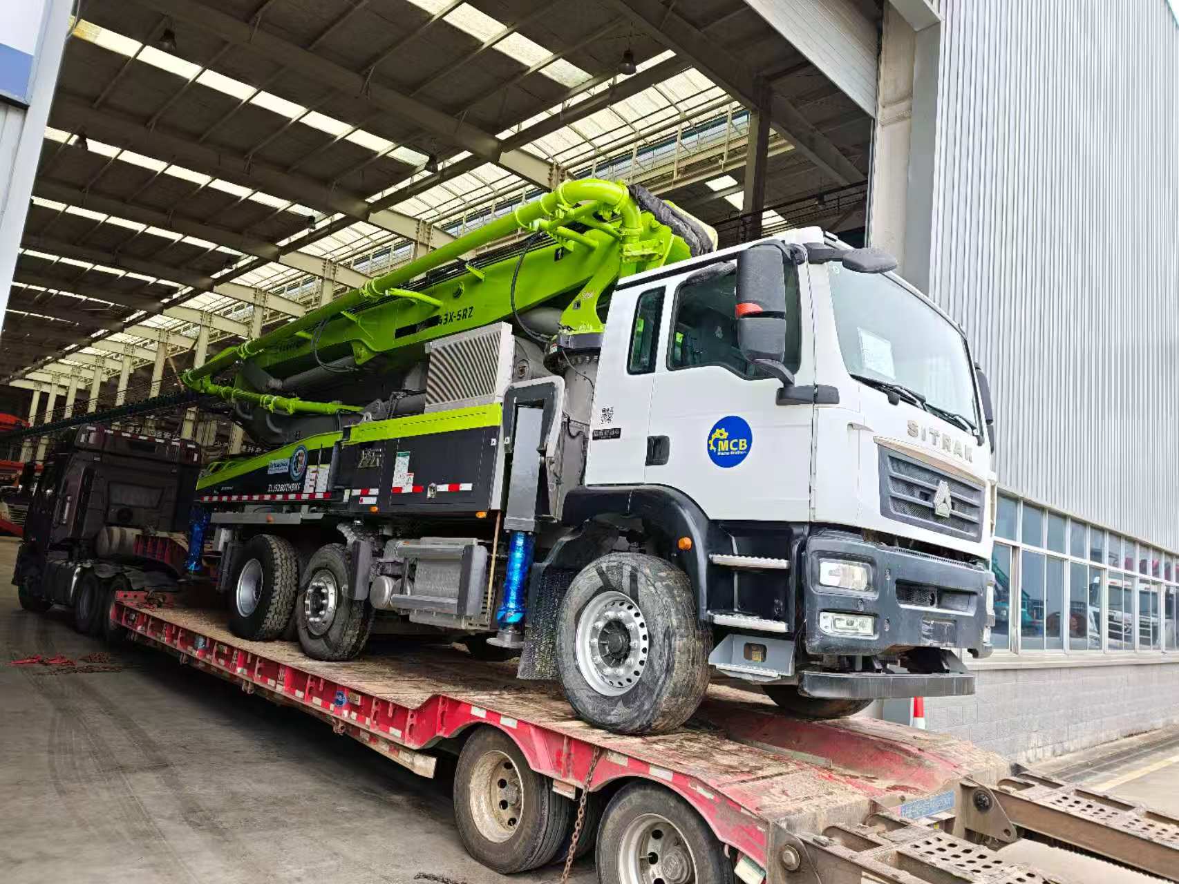 Original Mechabro field photo of a 2023 Zoomlion concrete pump truck 43m loaded for an Africa-bound customer shipment