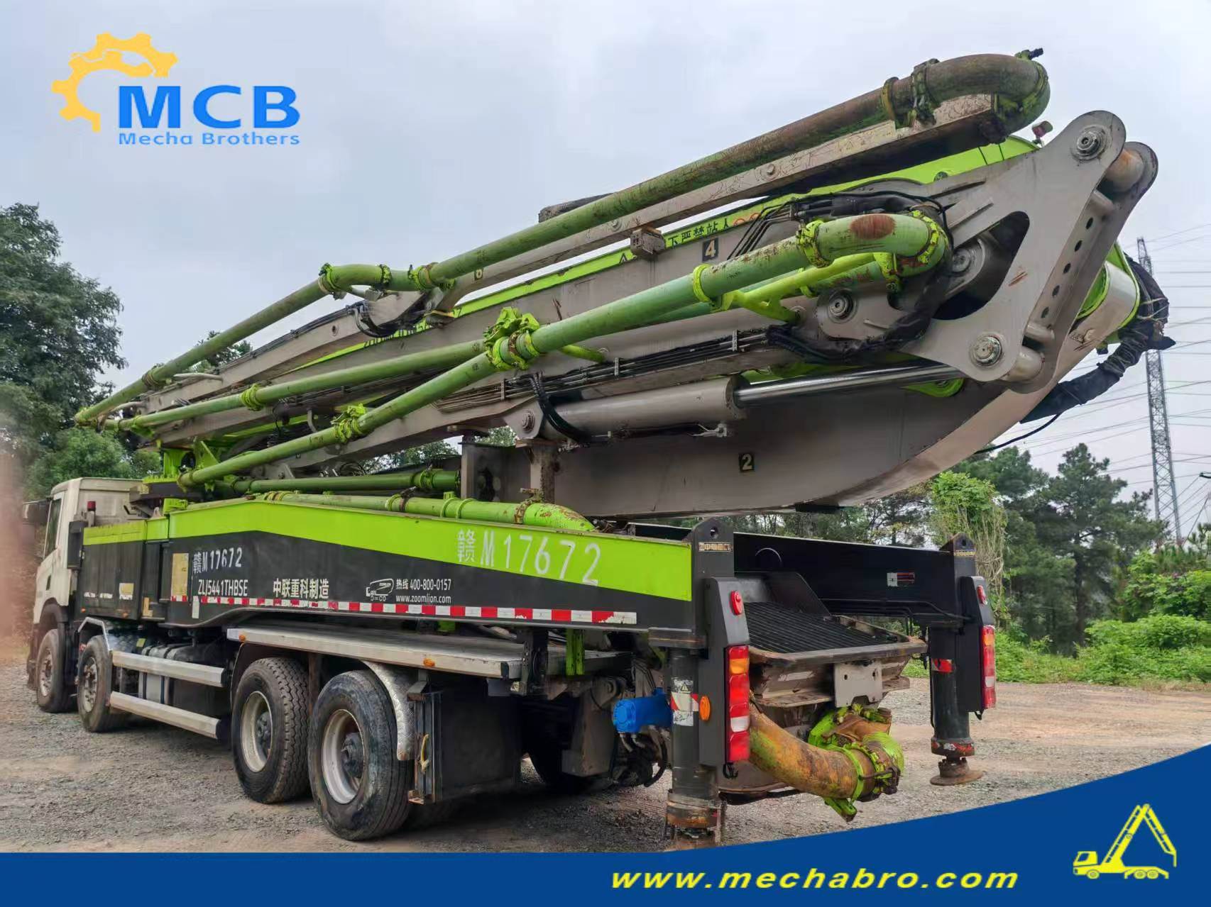 Original Mechabro field photo showing the folded boom and rear of the newly acquired 2020 Zoomlion concrete pump truck