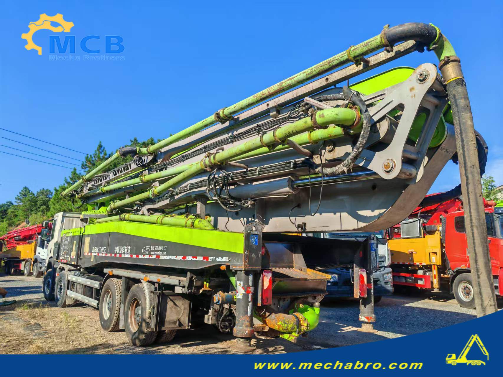 Original Mechabro field photo showing the folded boom and rear of the 2021 Zoomlion 59m concrete pump truck