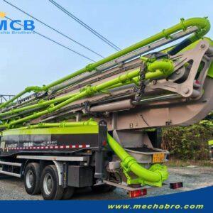 2022 Zoomlion 61.2m SITRAK pump truck — rear-left view with folded boom 2022 Zoomlion 61.2m concrete pump truck on SITRAK C7H chassis, rear-left view with folded boom