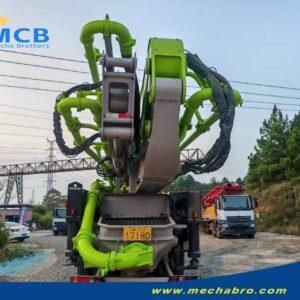 2022 Zoomlion 61.2m SITRAK pump truck — rear view with hopper and folded boom 2022 Zoomlion 61.2m concrete pump truck on SITRAK C7H chassis, rear view with hopper and folded boom