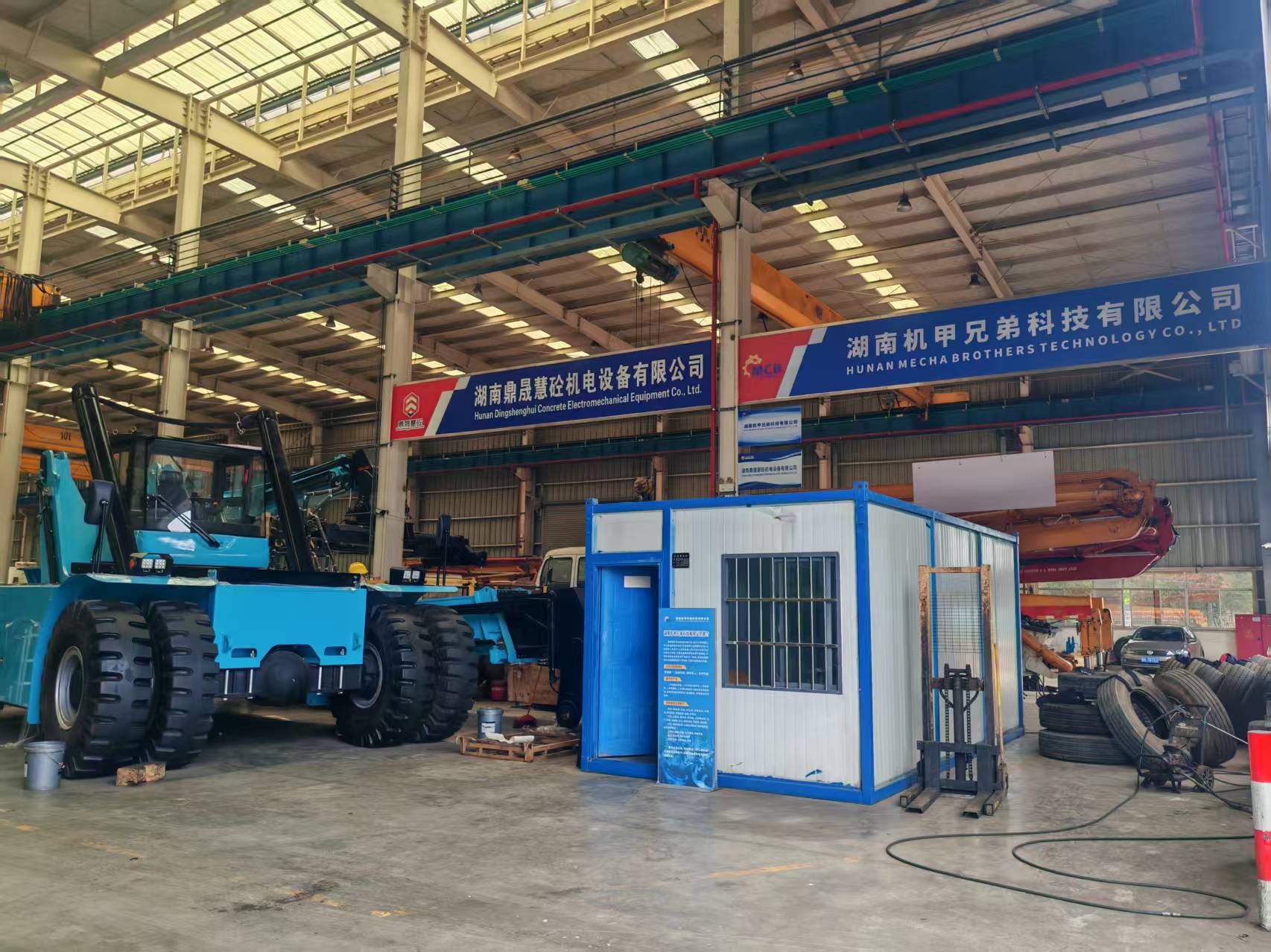 Original Mechabro field photo of the used concrete pump truck refurbishment workshop and company sign in Changsha